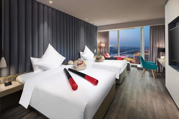 Imagen de la habitación del Hotel Ramada Encore By Wyndham Yangzhoudong Railway Station. Foto 10