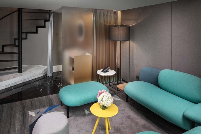 Imagen de la habitación del Hotel Ramada Encore By Wyndham Yangzhoudong Railway Station. Foto 15