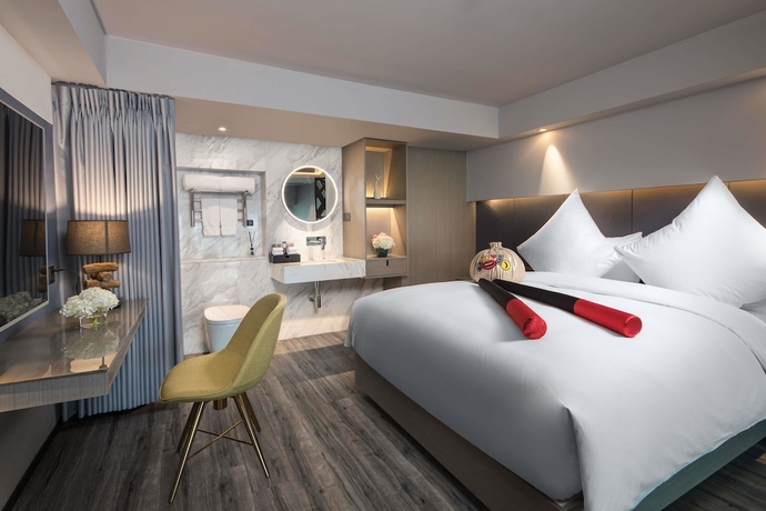 Imagen de la habitación del Hotel Ramada Encore By Wyndham Yangzhoudong Railway Station. Foto 16