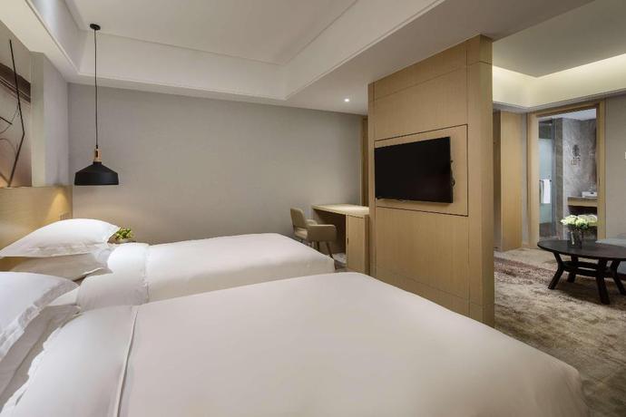 Imagen de la habitación del Hotel Ramada Encore Wyndham Huzhou. Foto 15