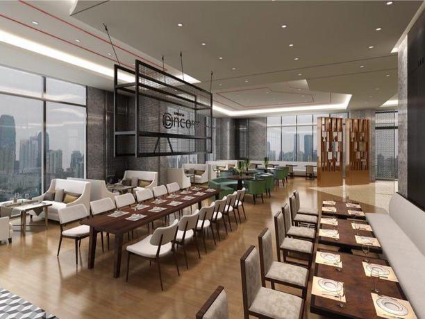 Imagen del bar/restaurante del Hotel Ramada Encore by Wyndham Chongqing Yubei. Foto 4