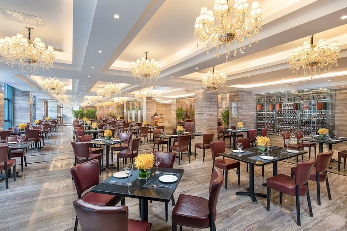 Imagen del bar/restaurante del Hotel Ramada Encore by Wyndham Guiyang. Foto 4