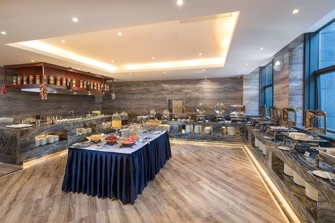 Imagen del bar/restaurante del Hotel Ramada Encore by Wyndham Guiyang. Foto 5