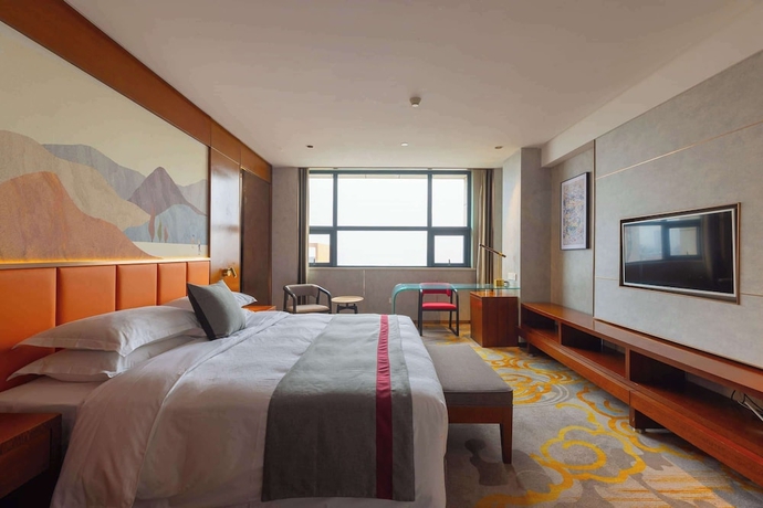 Imagen de la habitación del Hotel Ramada Encore by Wyndham Jingzhou Shashi. Foto 4