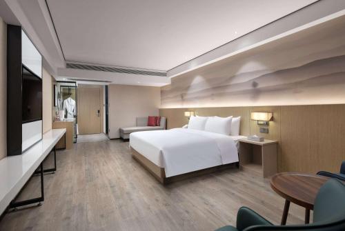 Imagen de la habitación del Hotel Ramada Encore by Wyndham Kunming Guandu. Foto 10