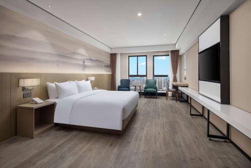 Imagen de la habitación del Hotel Ramada Encore by Wyndham Kunming Guandu. Foto 14