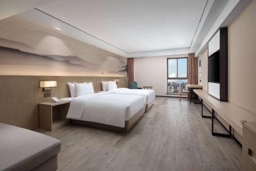 Imagen de la habitación del Hotel Ramada Encore by Wyndham Kunming Guandu. Foto 15