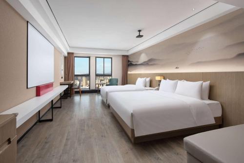 Imagen de la habitación del Hotel Ramada Encore by Wyndham Kunming Guandu. Foto 17