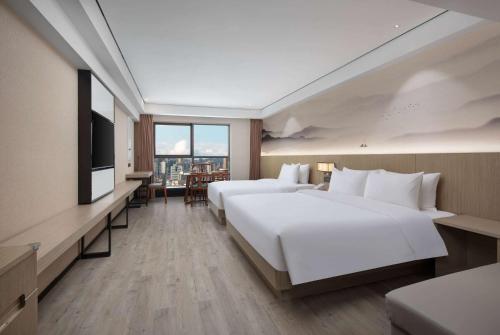 Imagen de la habitación del Hotel Ramada Encore by Wyndham Kunming Guandu. Foto 18