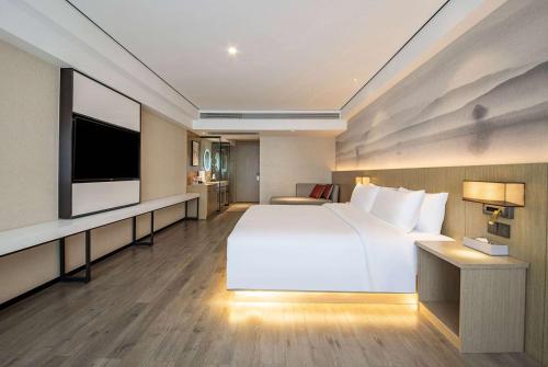 Imagen de la habitación del Hotel Ramada Encore by Wyndham Kunming Guandu. Foto 19