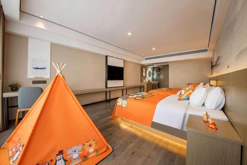 Imagen de la habitación del Hotel Ramada Encore by Wyndham Kunming Guandu. Foto 20