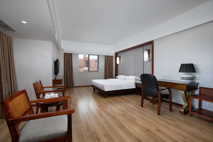 Imagen de la habitación del Hotel Ramada Encore by Wyndham Qionghai Downtown. Foto 10