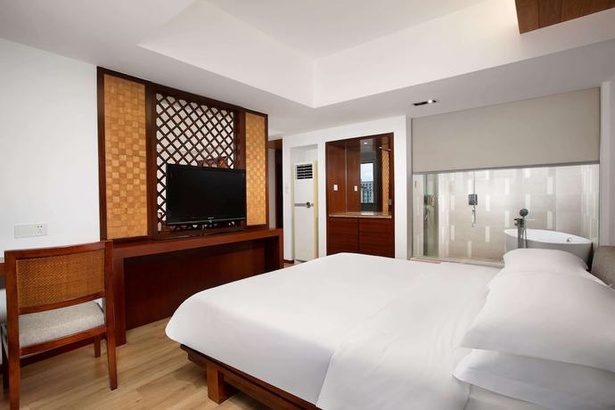 Imagen de la habitación del Hotel Ramada Encore by Wyndham Qionghai Downtown. Foto 11