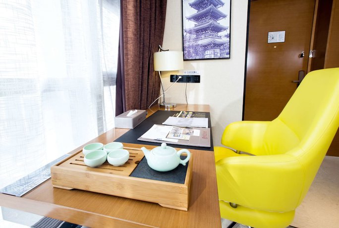 Imagen de la habitación del Hotel Ramada Encore by Wyndham Wuhan. Foto 7