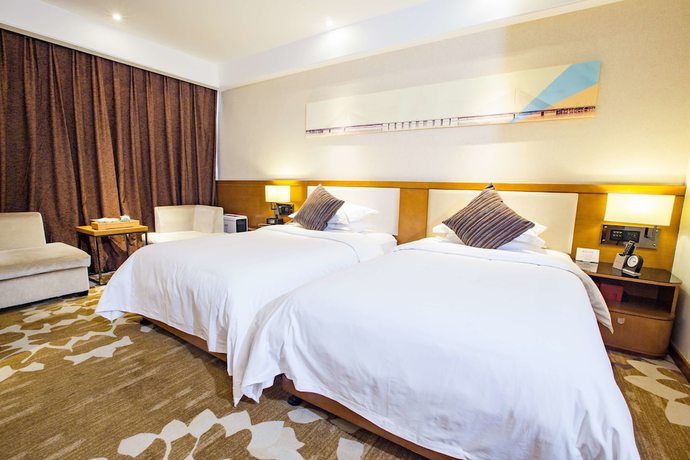 Imagen de la habitación del Hotel Ramada Encore by Wyndham Wuhan. Foto 8
