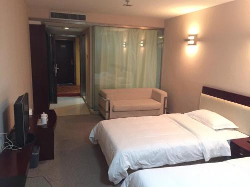 Imagen de la habitación del Hotel Ramada Encore by Wyndham Wuhan Int'l Conference Center. Foto 11