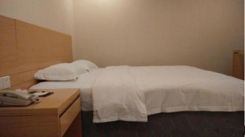 Imagen de la habitación del Hotel Ramada Encore by Wyndham Wuhan Int'l Conference Center. Foto 13