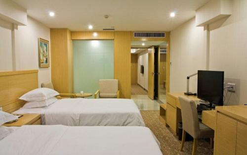 Imagen de la habitación del Hotel Ramada Encore by Wyndham Wuhan Int'l Conference Center. Foto 16