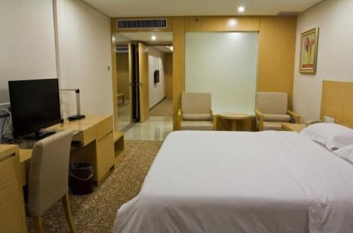 Imagen de la habitación del Hotel Ramada Encore by Wyndham Wuhan Int'l Conference Center. Foto 18