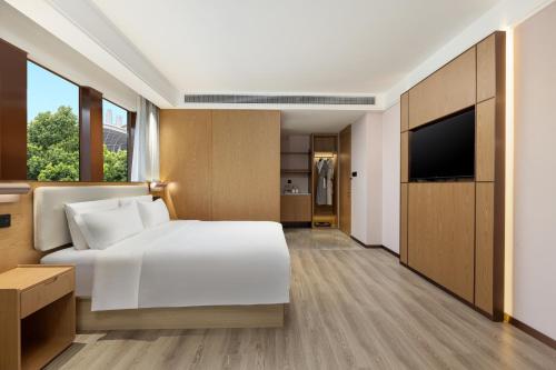 Imagen de la habitación del Hotel Ramada Encore by Wyndham Wuhan Station. Foto 7