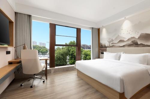 Imagen de la habitación del Hotel Ramada Encore by Wyndham Wuhan Station. Foto 8