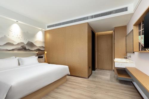 Imagen de la habitación del Hotel Ramada Encore by Wyndham Wuhan Station. Foto 10