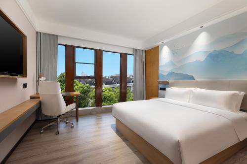 Imagen de la habitación del Hotel Ramada Encore by Wyndham Wuhan Station. Foto 11