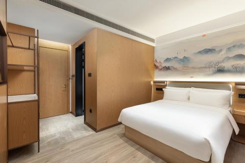 Imagen de la habitación del Hotel Ramada Encore by Wyndham Wuhan Station. Foto 12