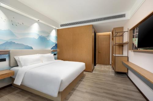 Imagen de la habitación del Hotel Ramada Encore by Wyndham Wuhan Station. Foto 13