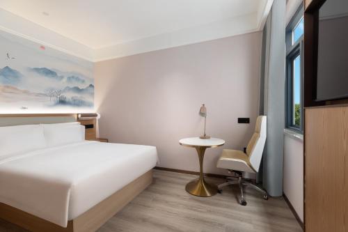 Imagen de la habitación del Hotel Ramada Encore by Wyndham Wuhan Station. Foto 14