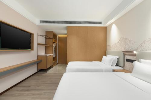 Imagen de la habitación del Hotel Ramada Encore by Wyndham Wuhan Station. Foto 15