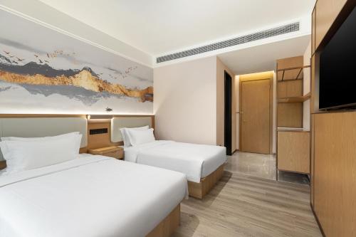 Imagen de la habitación del Hotel Ramada Encore by Wyndham Wuhan Station. Foto 16