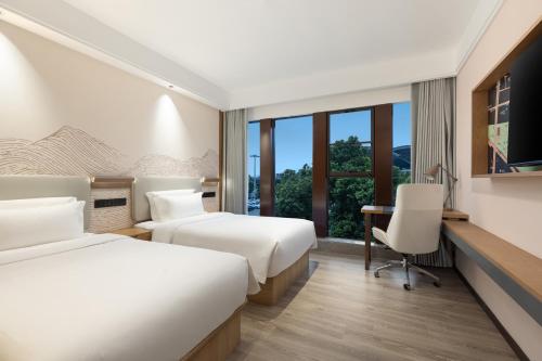 Imagen de la habitación del Hotel Ramada Encore by Wyndham Wuhan Station. Foto 17