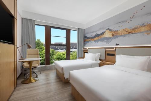 Imagen de la habitación del Hotel Ramada Encore by Wyndham Wuhan Station. Foto 18