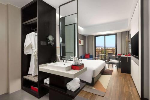 Imagen de la habitación del Hotel Ramada Encore by Wyndham Xishuangbanna Jinghong. Foto 11