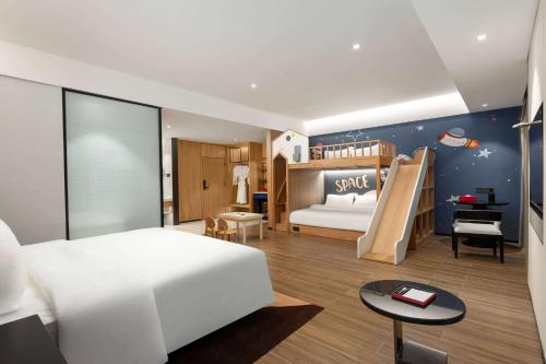 Imagen de la habitación del Hotel Ramada Encore by Wyndham Xishuangbanna Jinghong. Foto 13