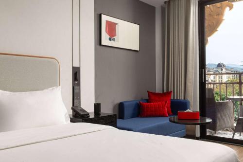 Imagen de la habitación del Hotel Ramada Encore by Wyndham Xishuangbanna Jinghong. Foto 16