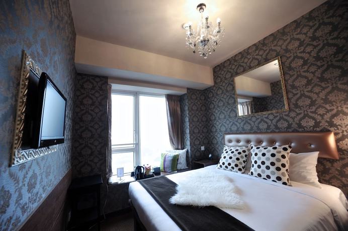 Imagen de la habitación del Hotel Ramada Grand Tsim Sha Tsui. Foto 14