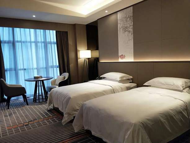 Imagen de la habitación del Hotel Ramada Plaza By Wyndham Changsha Wangcheng. Foto 12