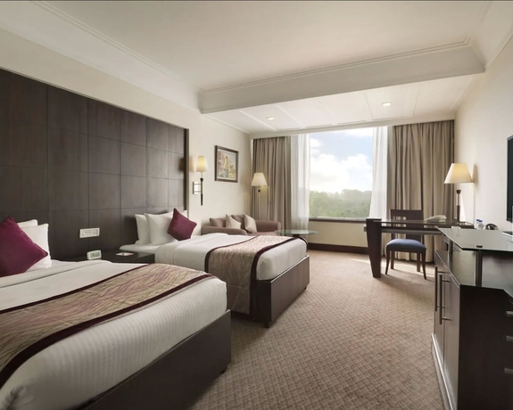 Imagen de la habitación del Hotel Ramada Plaza By Wyndham Jhv Varanasi. Foto 11