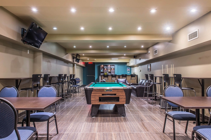 Imagen del bar/restaurante del Hotel Ramada Plaza By Wyndham Montreal. Foto 2