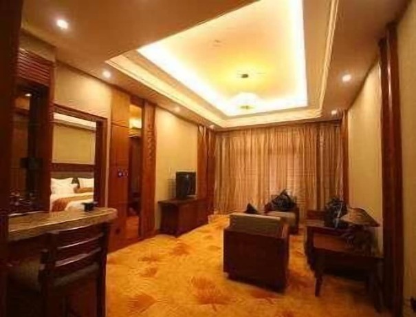 Imagen de la habitación del Hotel Ramada Plaza By Wyndham Xishuangbanna South. Foto 4