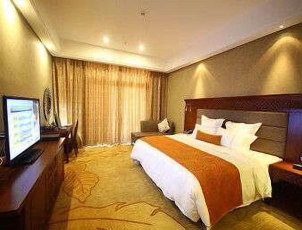 Imagen de la habitación del Hotel Ramada Plaza By Wyndham Xishuangbanna South. Foto 6
