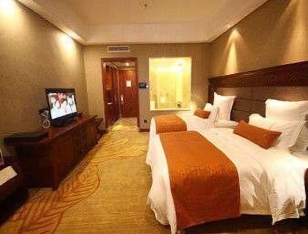 Imagen de la habitación del Hotel Ramada Plaza By Wyndham Xishuangbanna South. Foto 7