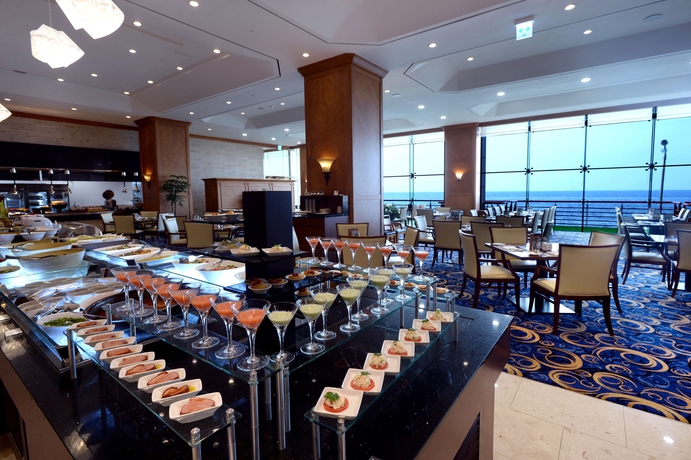 Imagen del bar/restaurante del Hotel Ramada Plaza Jeju Ocean Front. Foto 3