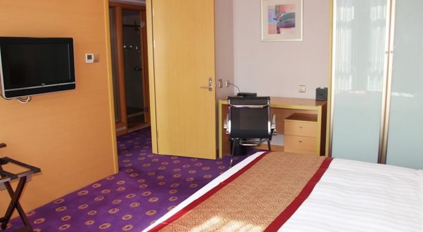Imagen de la habitación del Hotel Ramada Plaza Pu Dong South Shanghai. Foto 4