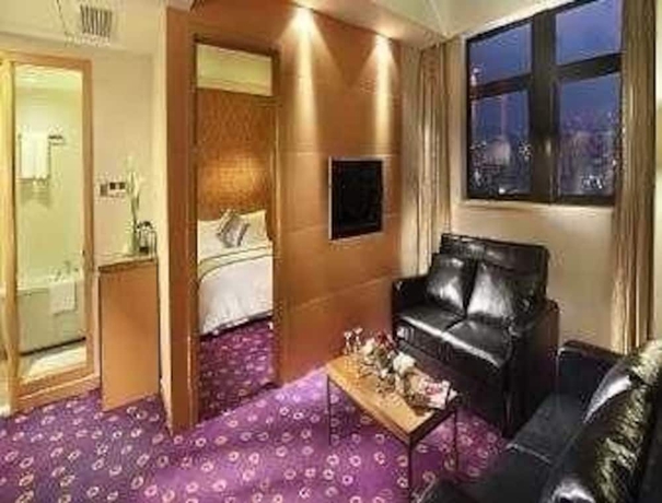 Imagen de la habitación del Hotel Ramada Plaza Pu Dong South Shanghai. Foto 5