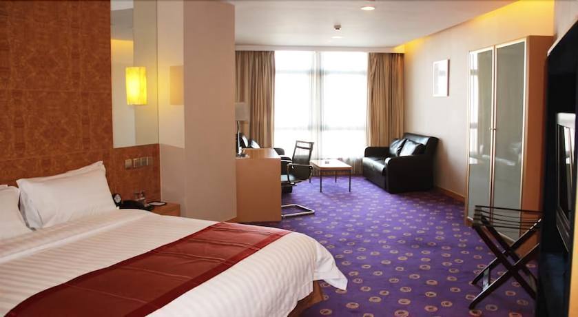 Imagen de la habitación del Hotel Ramada Plaza Pu Dong South Shanghai. Foto 9