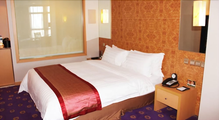 Imagen de la habitación del Hotel Ramada Plaza Pu Dong South Shanghai. Foto 10