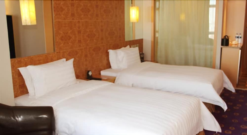 Imagen de la habitación del Hotel Ramada Plaza Pu Dong South Shanghai. Foto 11